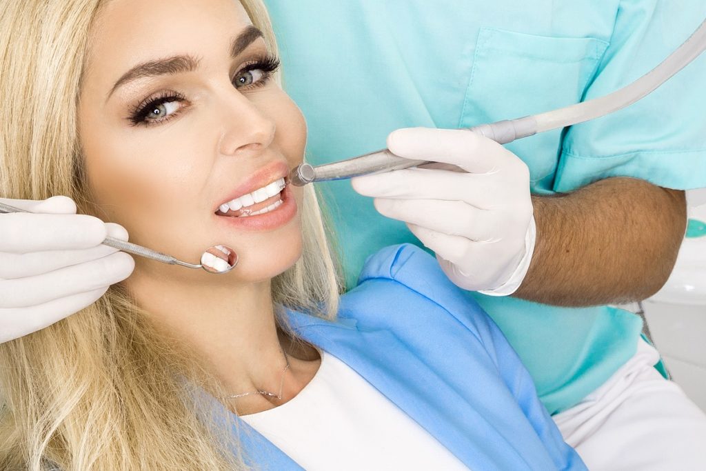 woman with white teeth in the dental clinic