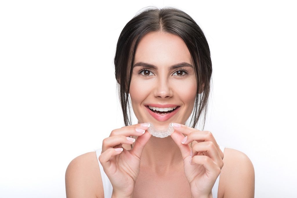 woman holding an invisible braces