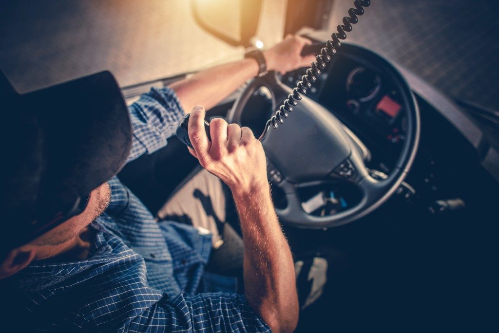 Truck driver talking to someone