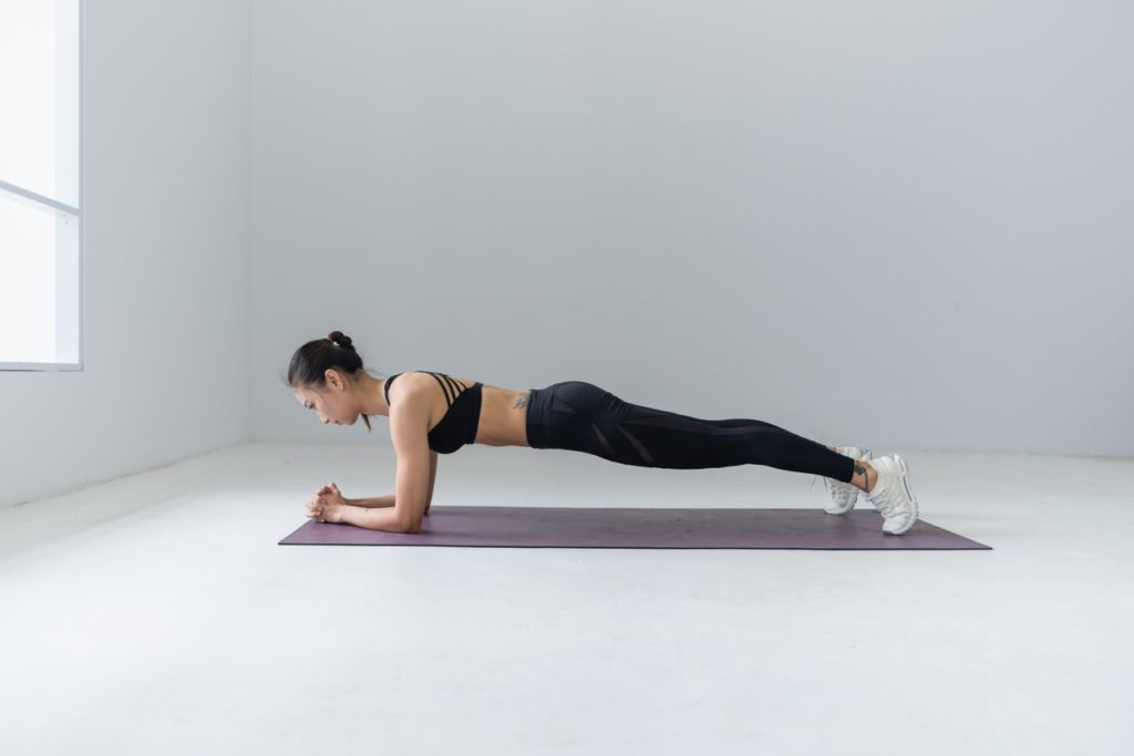woman doing yoga planking