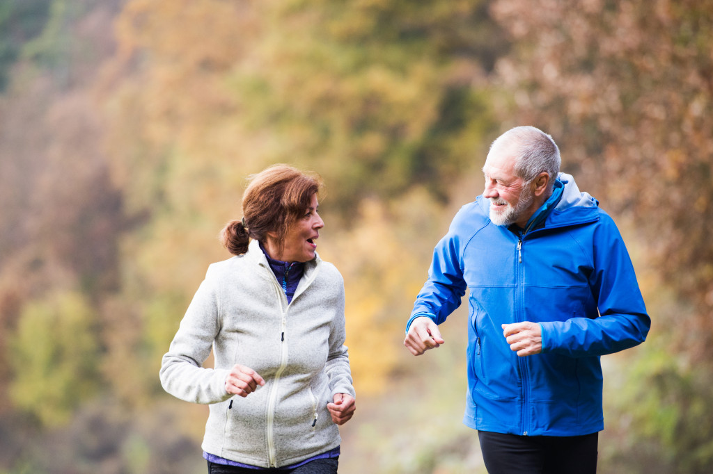 elderly couple jogging